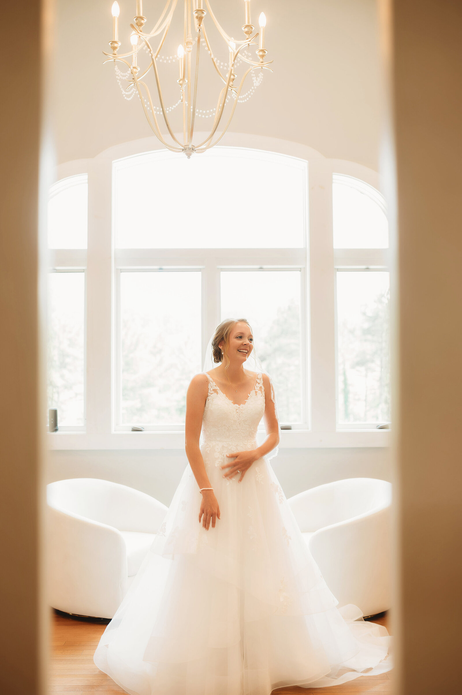 Bride prepares for her wedding day with her mother in the bridal suit at Chestnut Ridge Events in Asheville, NC