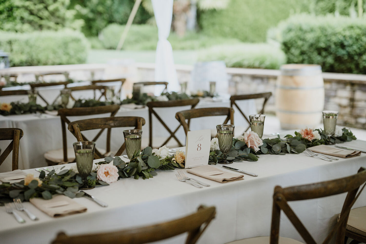 Rustic tables with greenery garlands