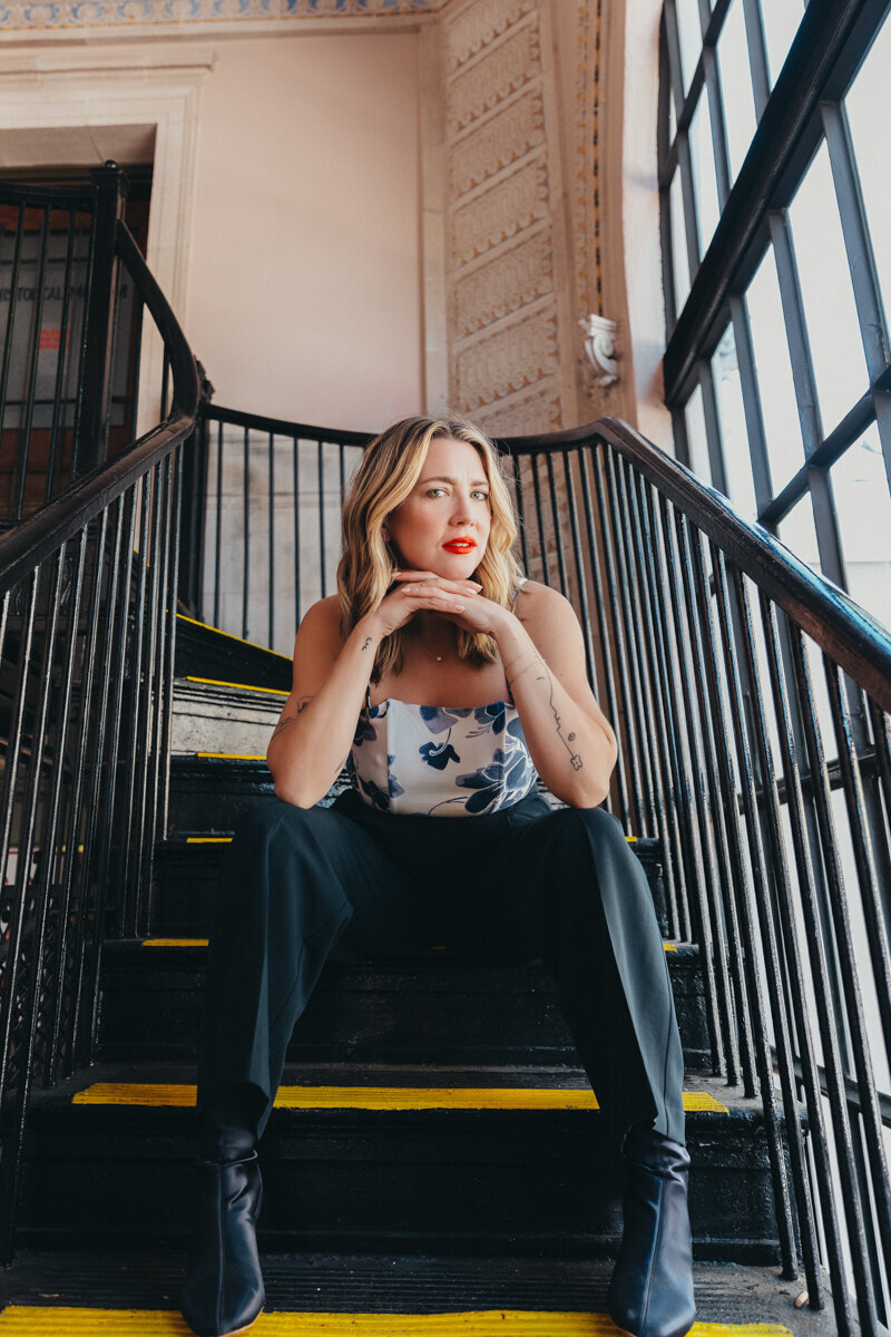 very cool looking female posing on stairwell