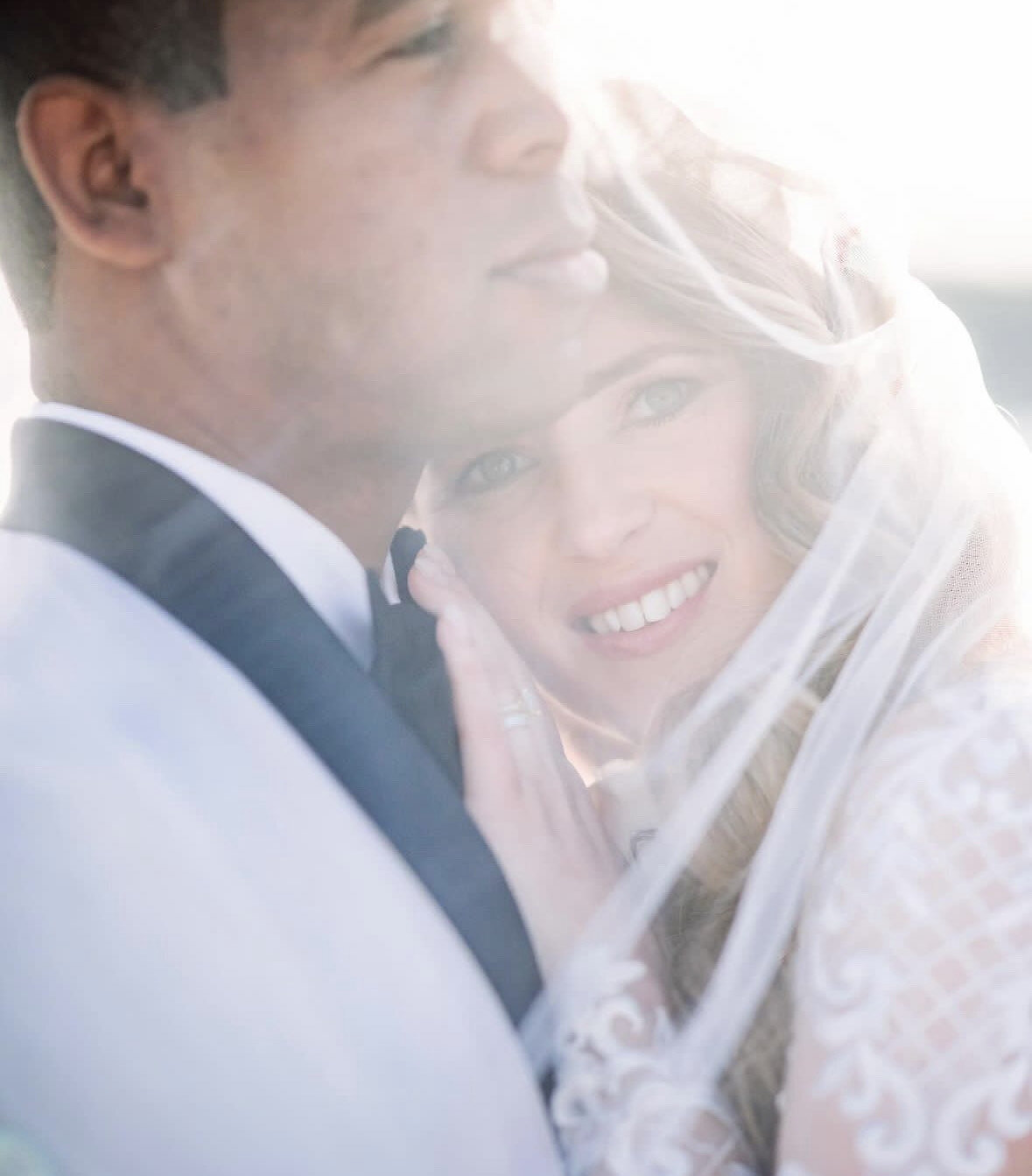 bride getting blush put on her cheek
