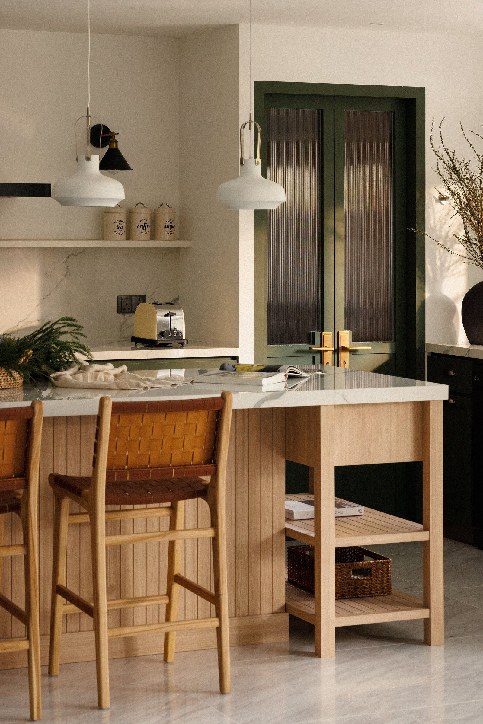 wide view of a kitchen with island and island stools