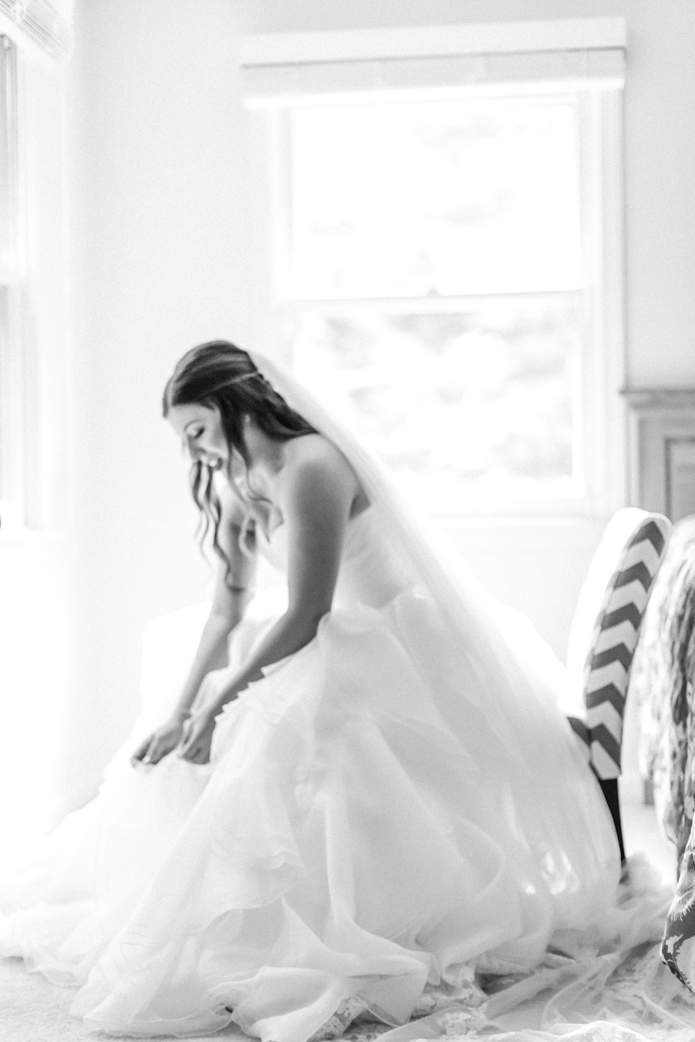 bride getting ready and fixing her dress