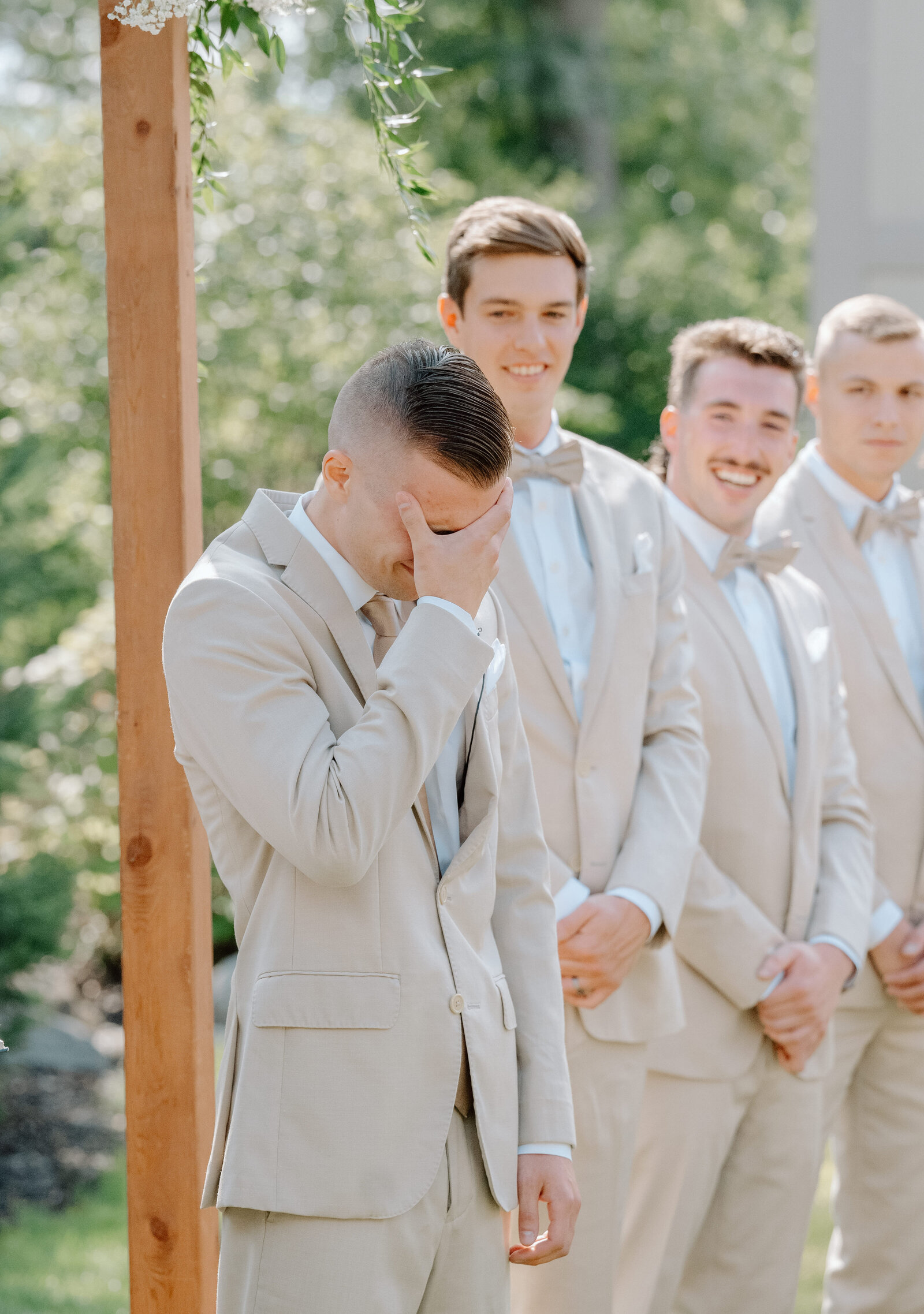 groom crying at wedding