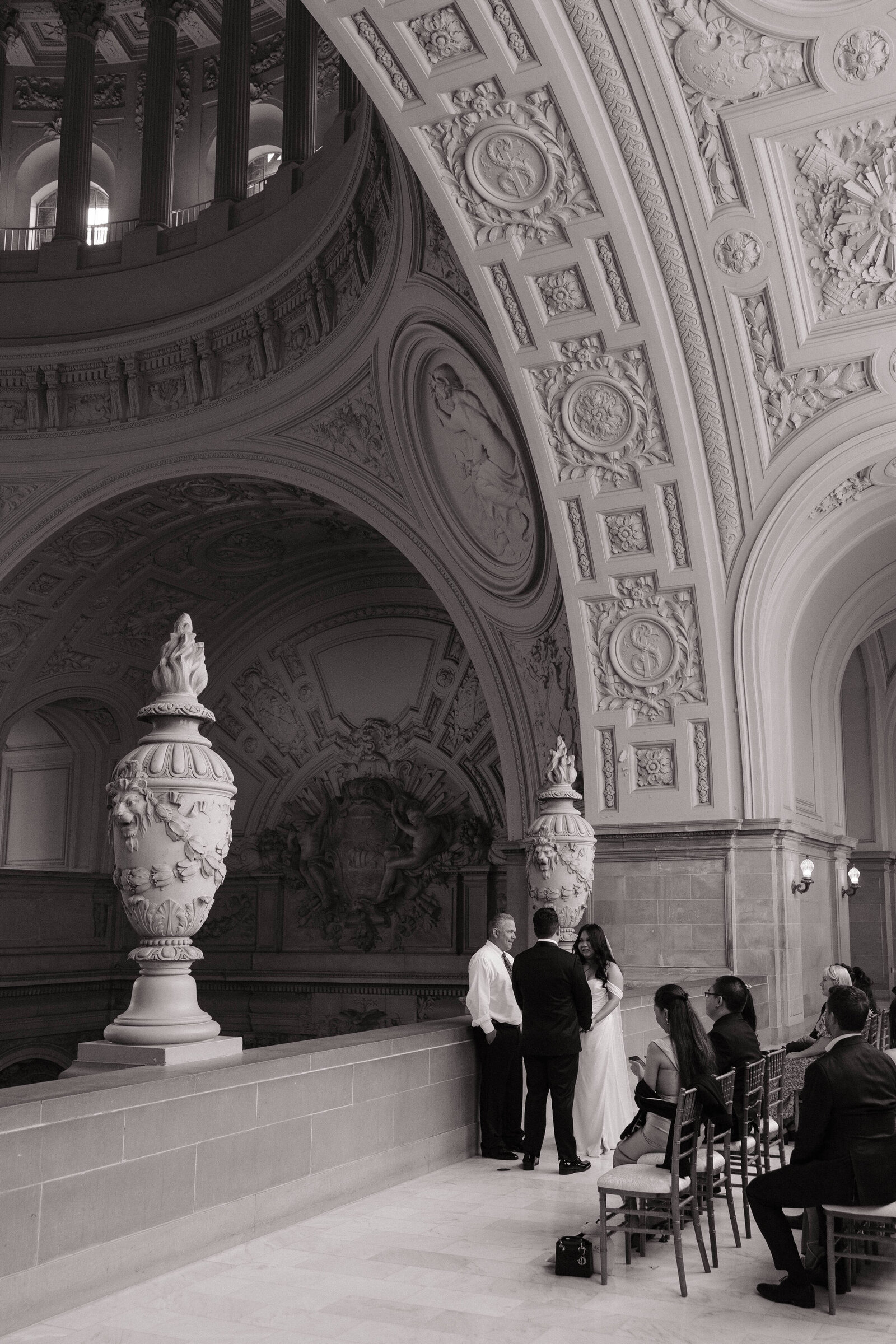 Couple saying vows under dome in San Francisco City Hall