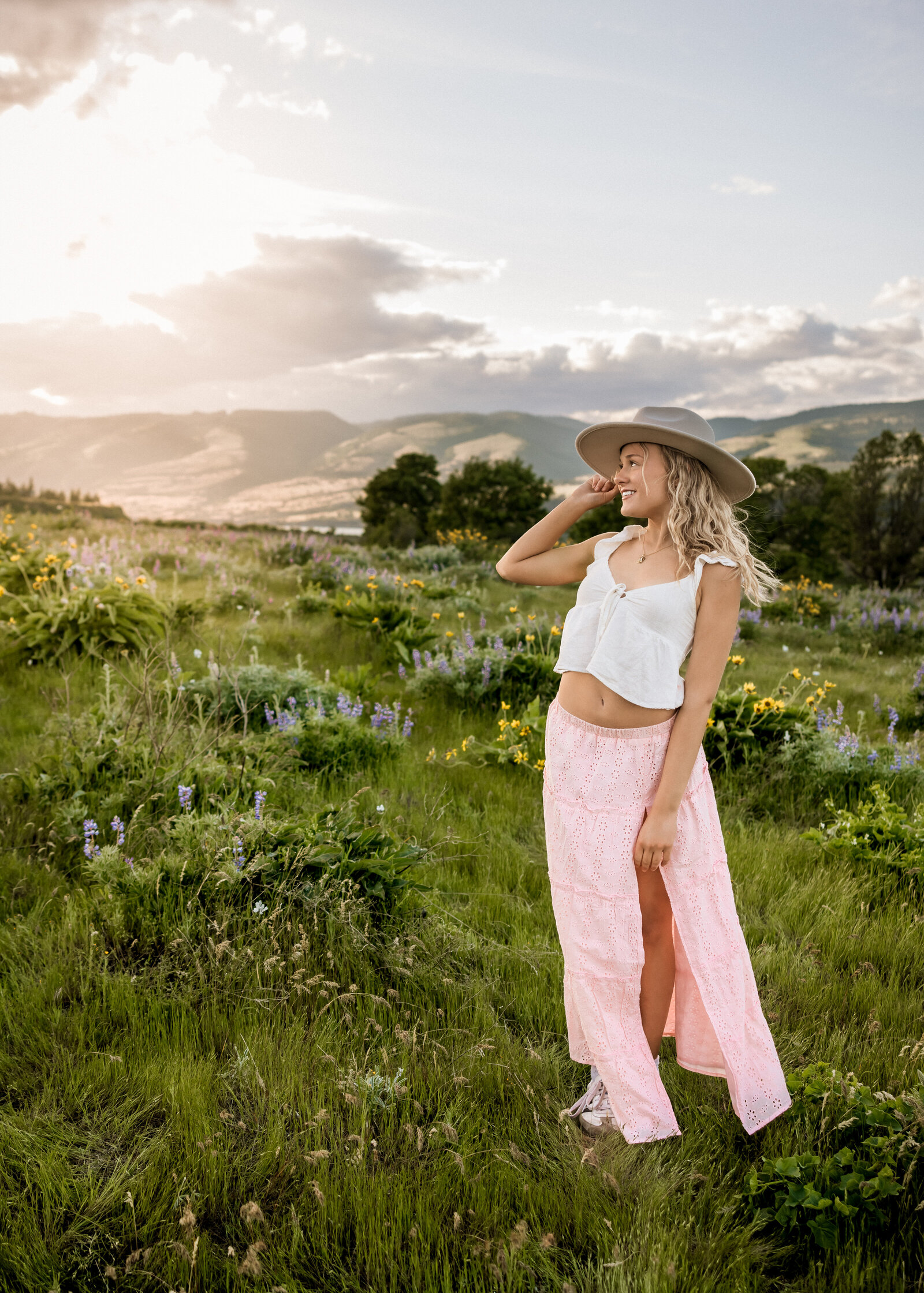 Girl at Tom McCall Park at sunset with wildflowers