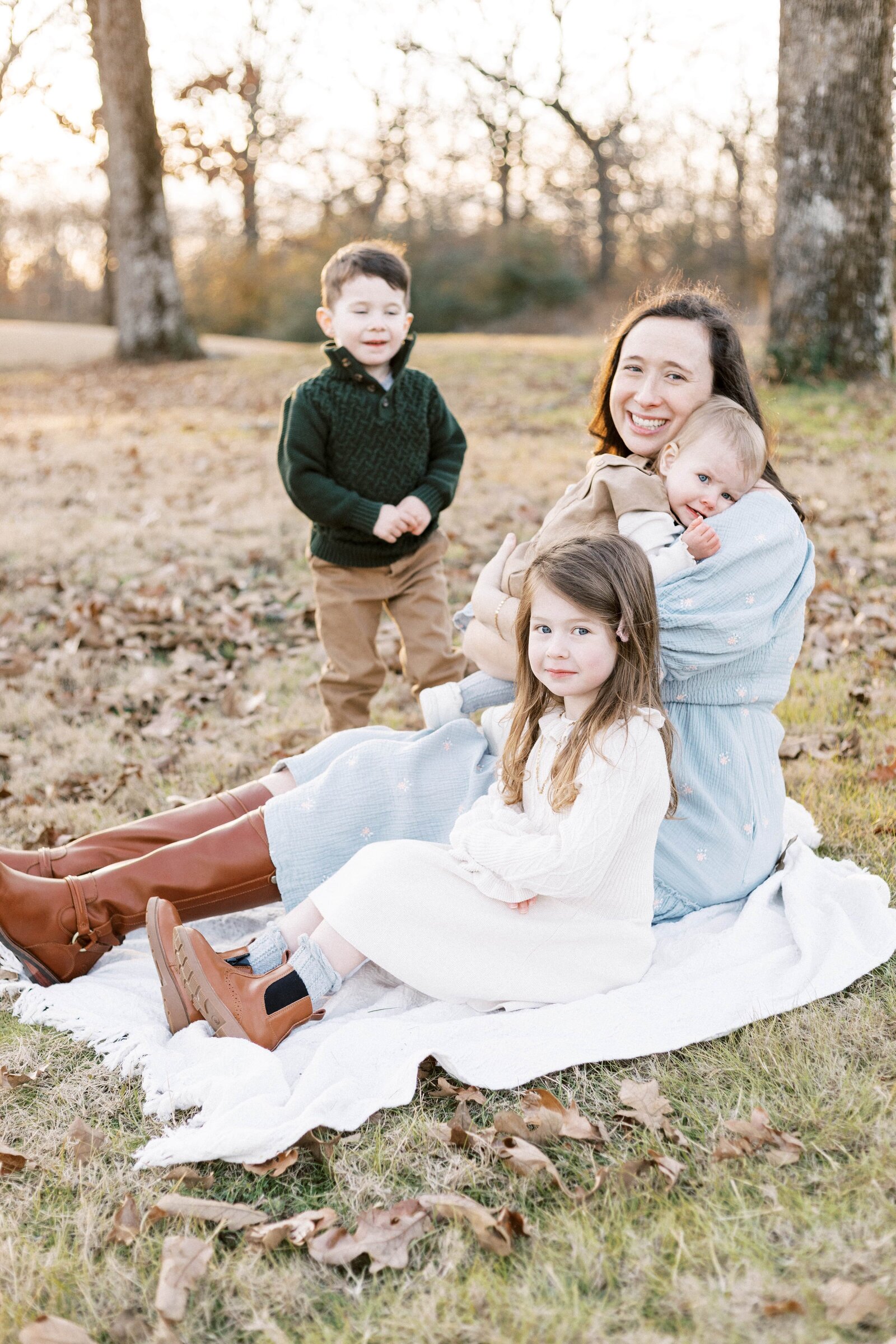 mom sitting and hugging her children during peoria illinois family photos 