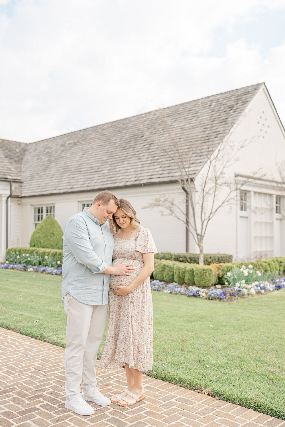 expecting couple looking down at mom's belly during maternity photography in Loudoun County, Virginia