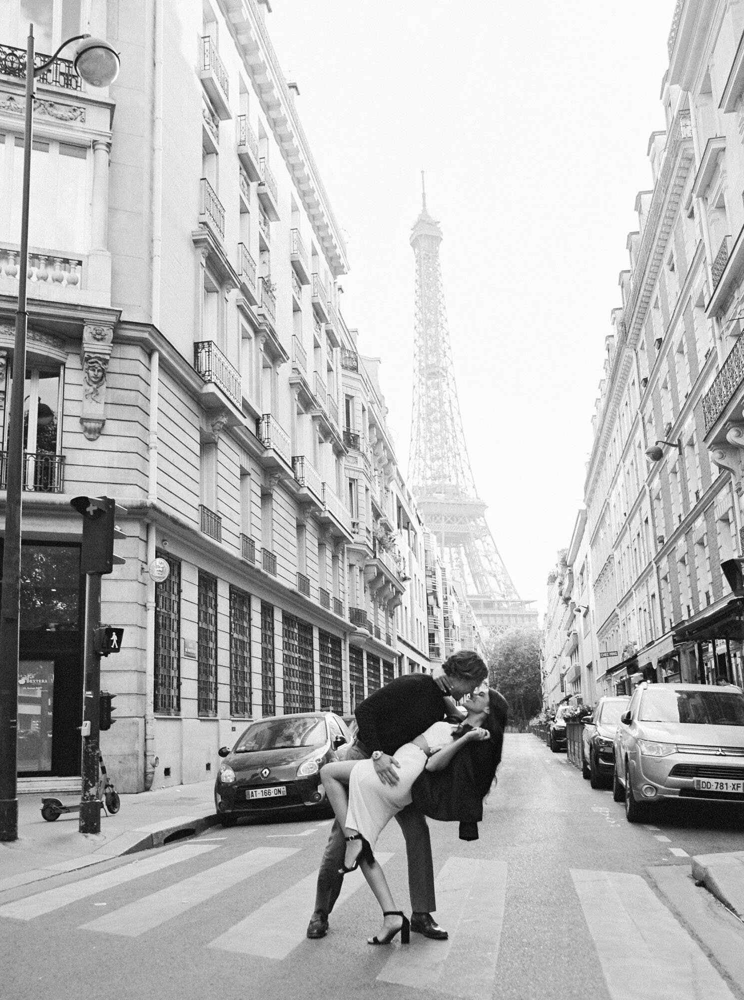 Couple kissing in a Parisian street