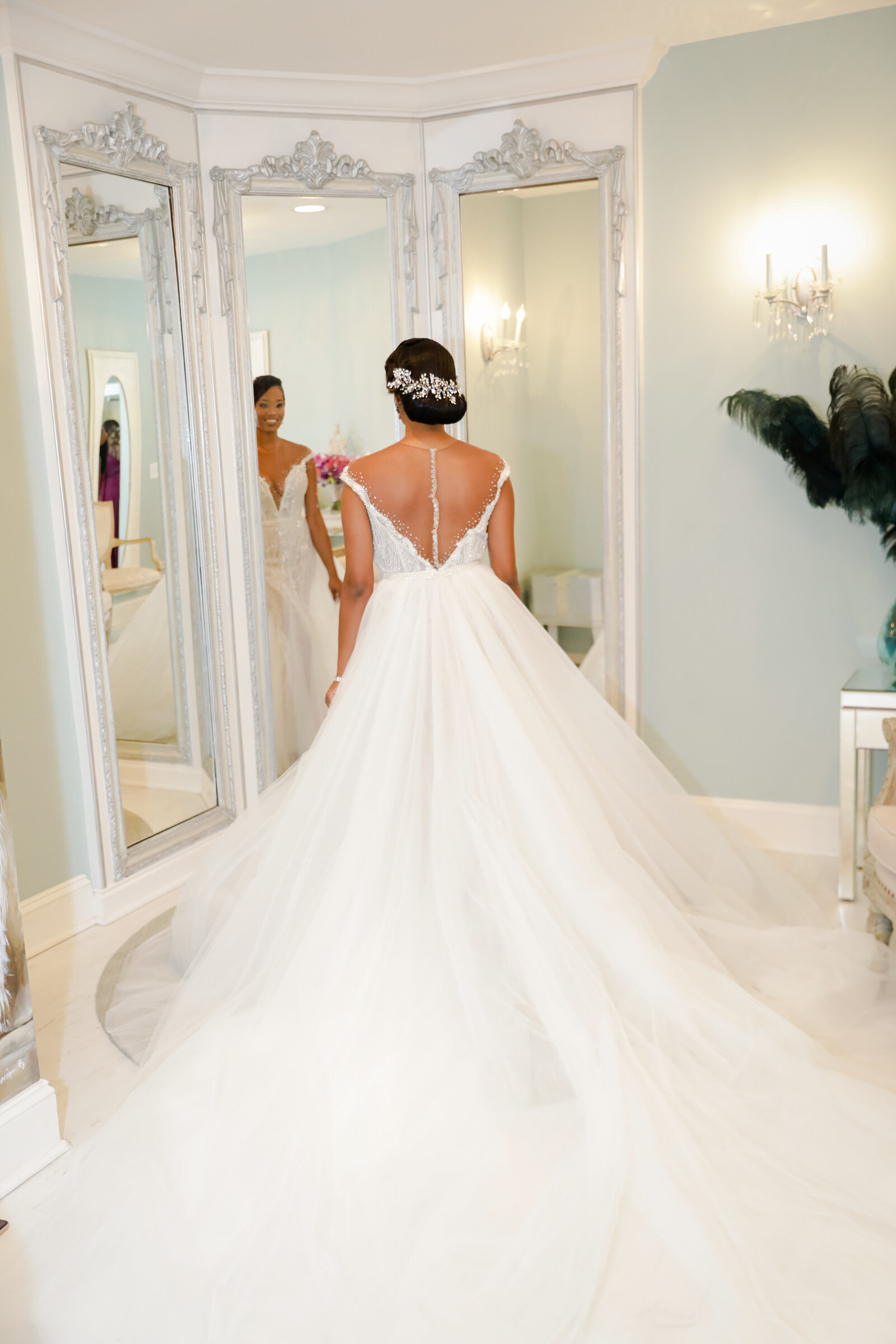Elegant bridal gown with a long flowing train at a luxury Raleigh wedding venue.