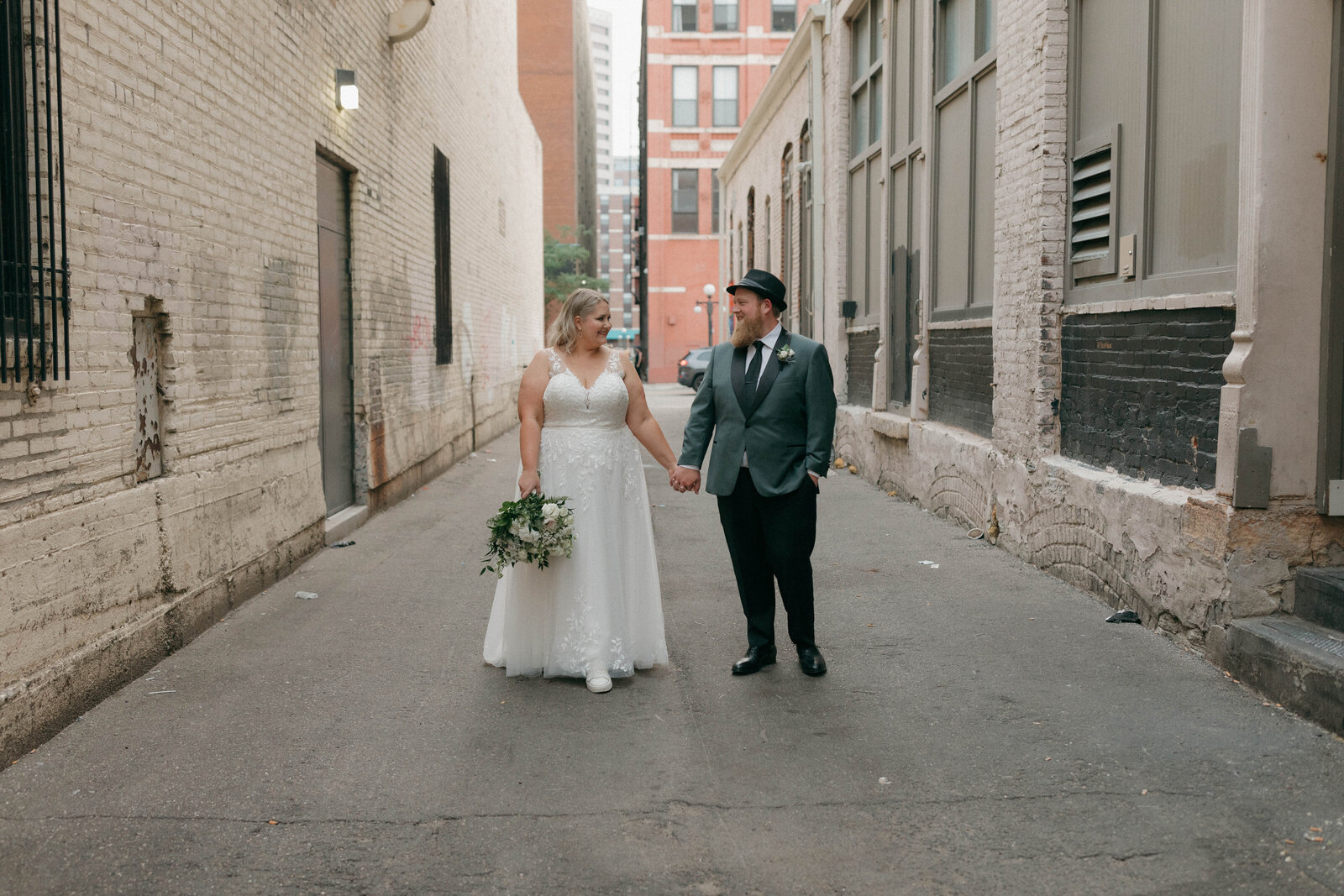 bride-groom-walking-down-alley-minneapolis