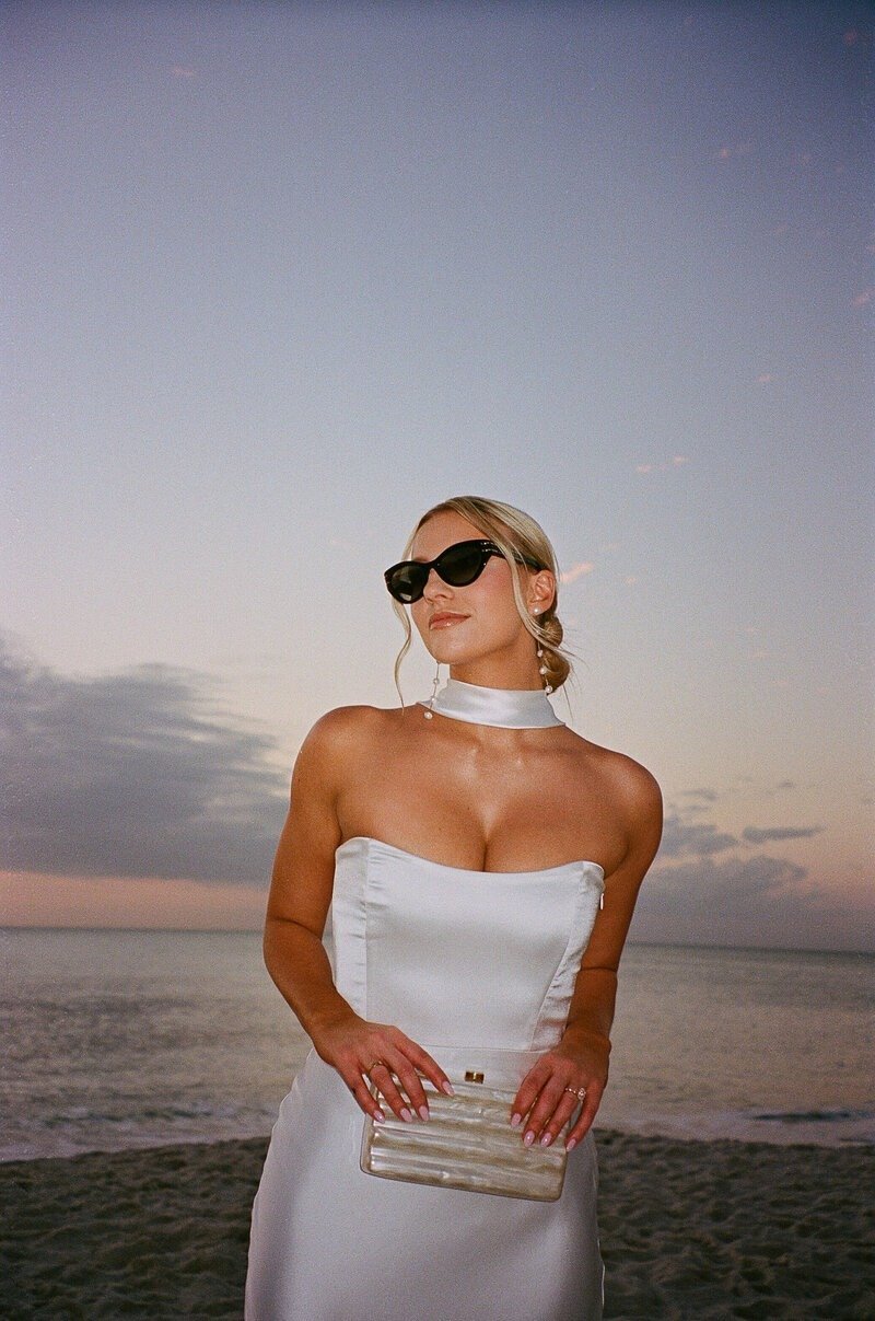 bride posing in sunset taken by fort myers florida wedding photographers