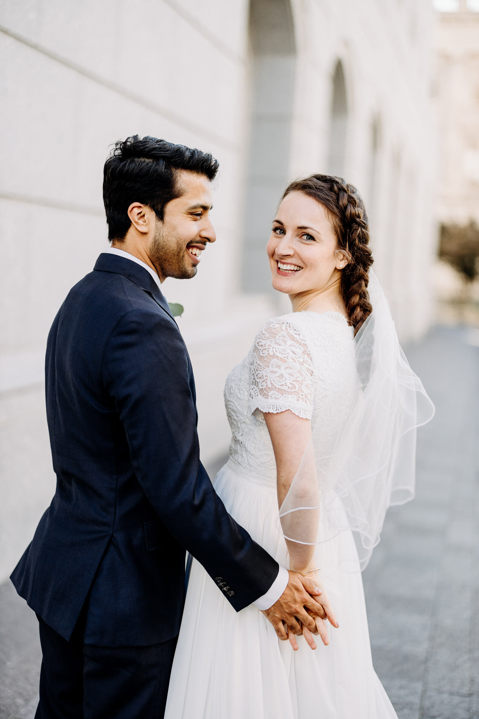 bride and groom smiling at church