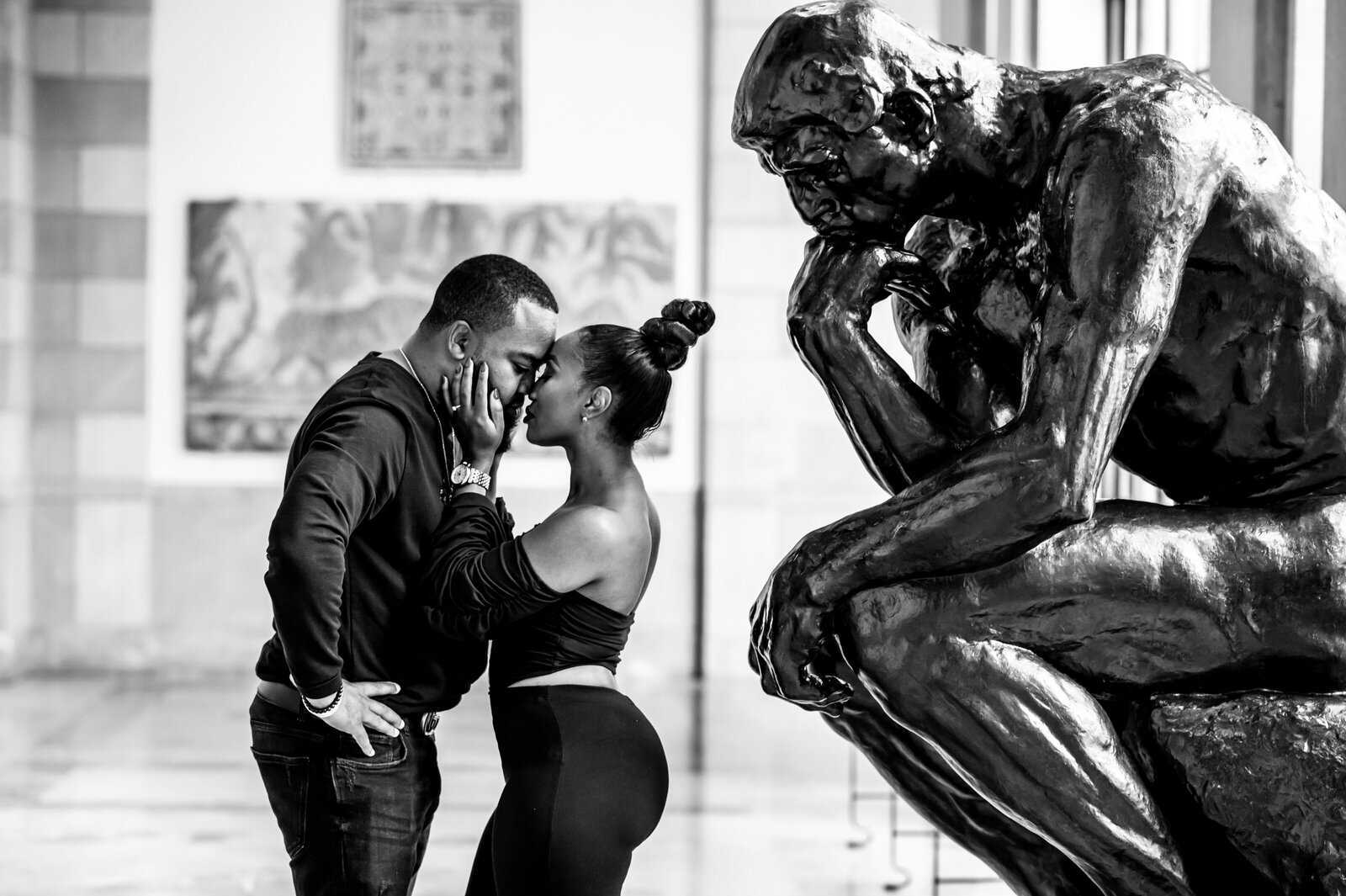 couple in front of statue