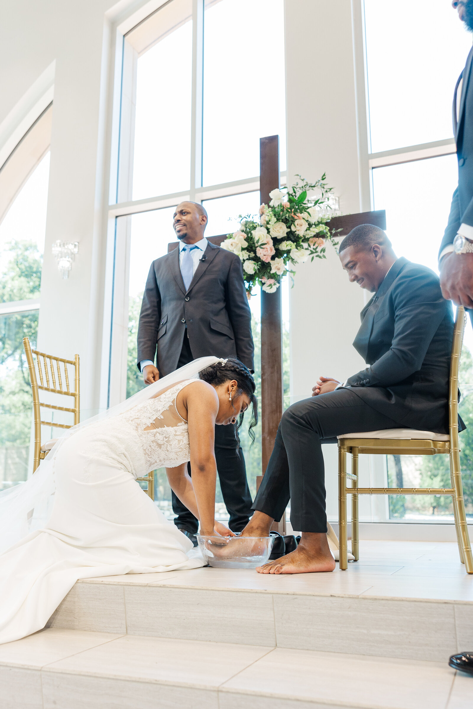 bride washing groom's feet wedding ritual ceremony