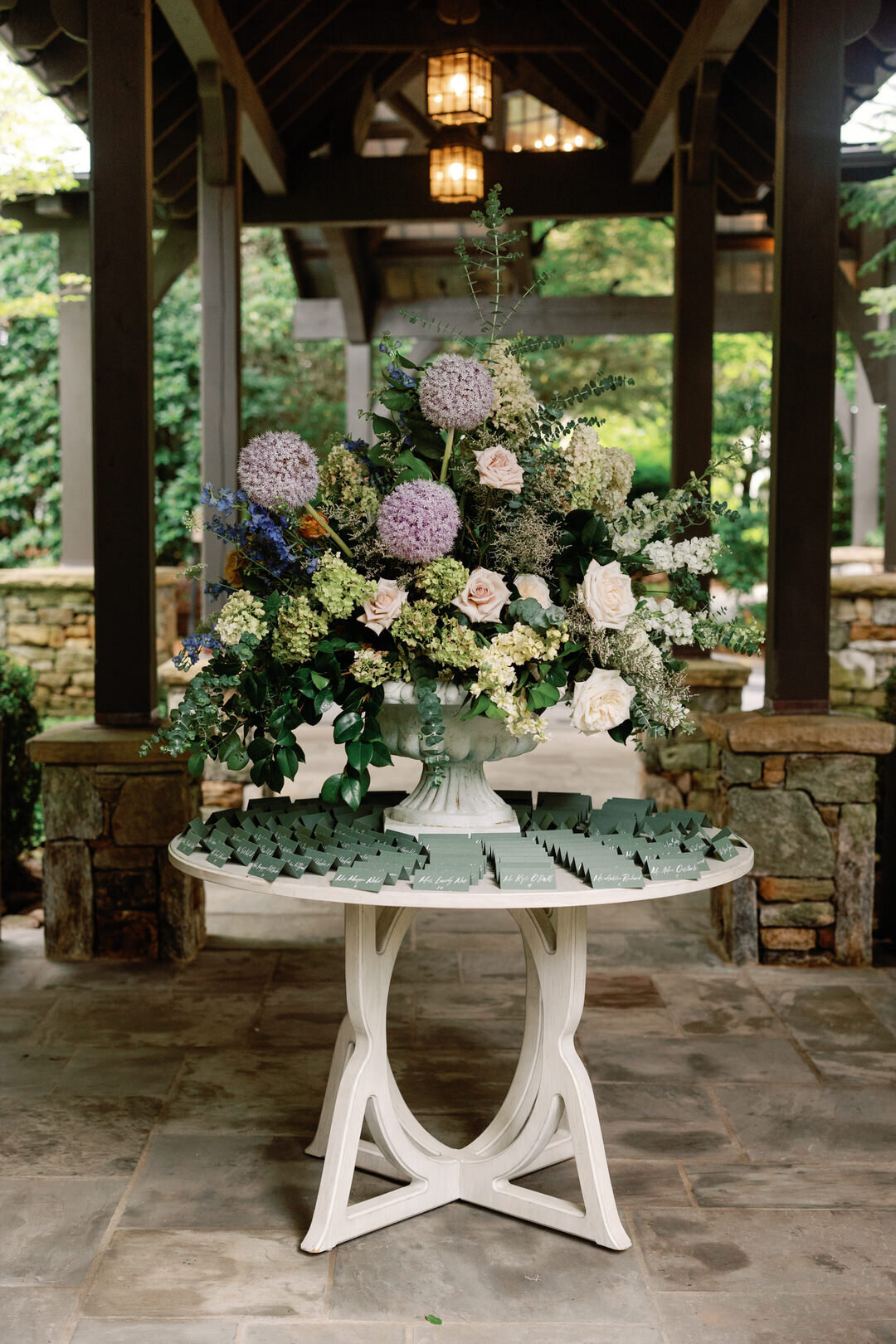 Wedding reception escort card table with flowers