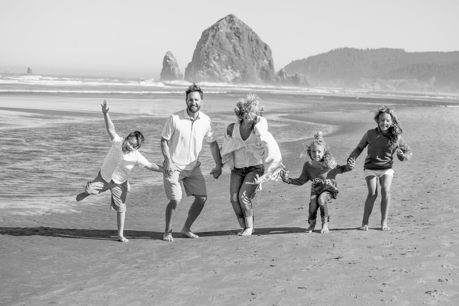 black and white family photo on Cannon Beach