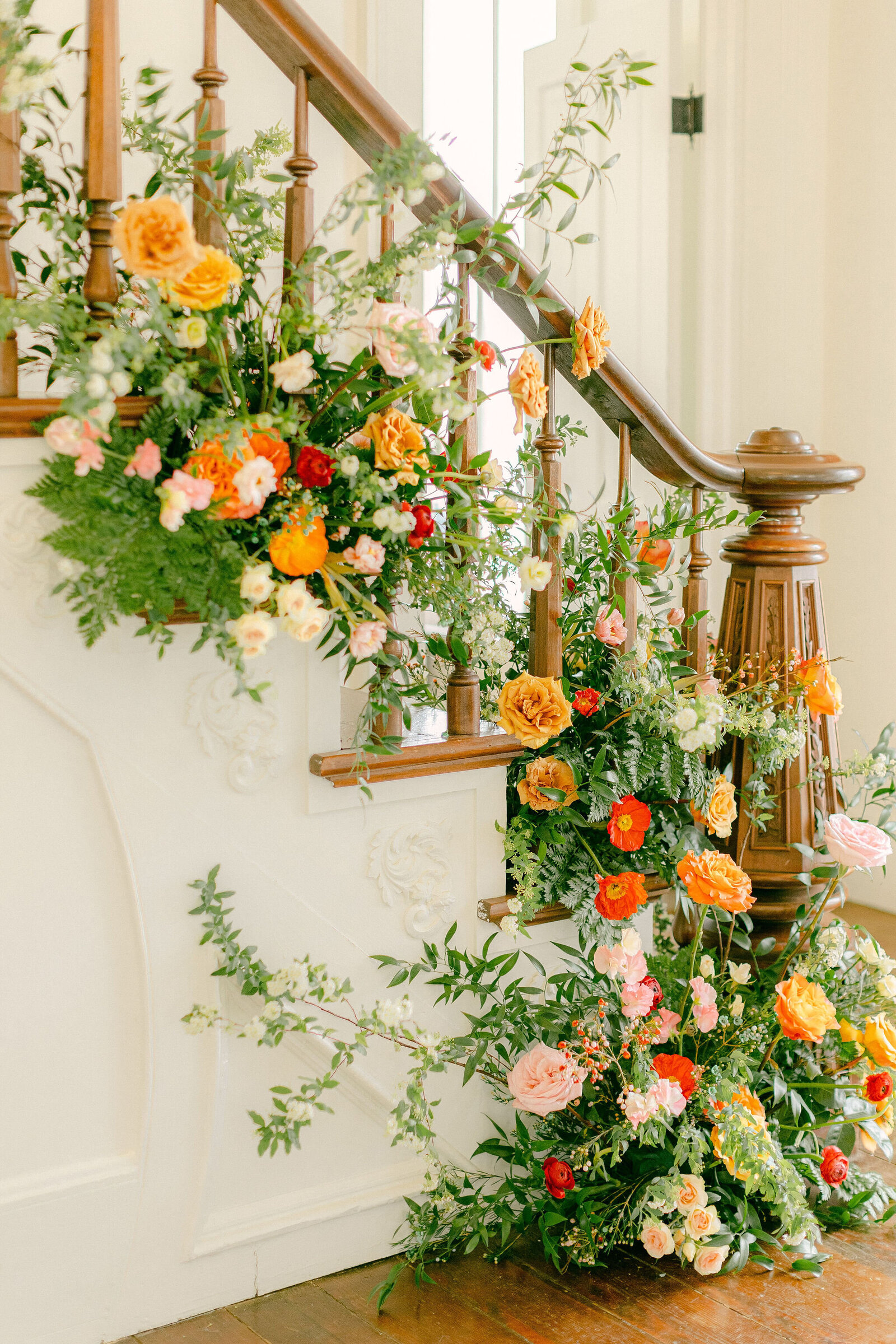 Statement aisle markers with bold florals lining the ceremony walkway. Created by The Floral Eclectic for a modern wedding in Fort Worth.
