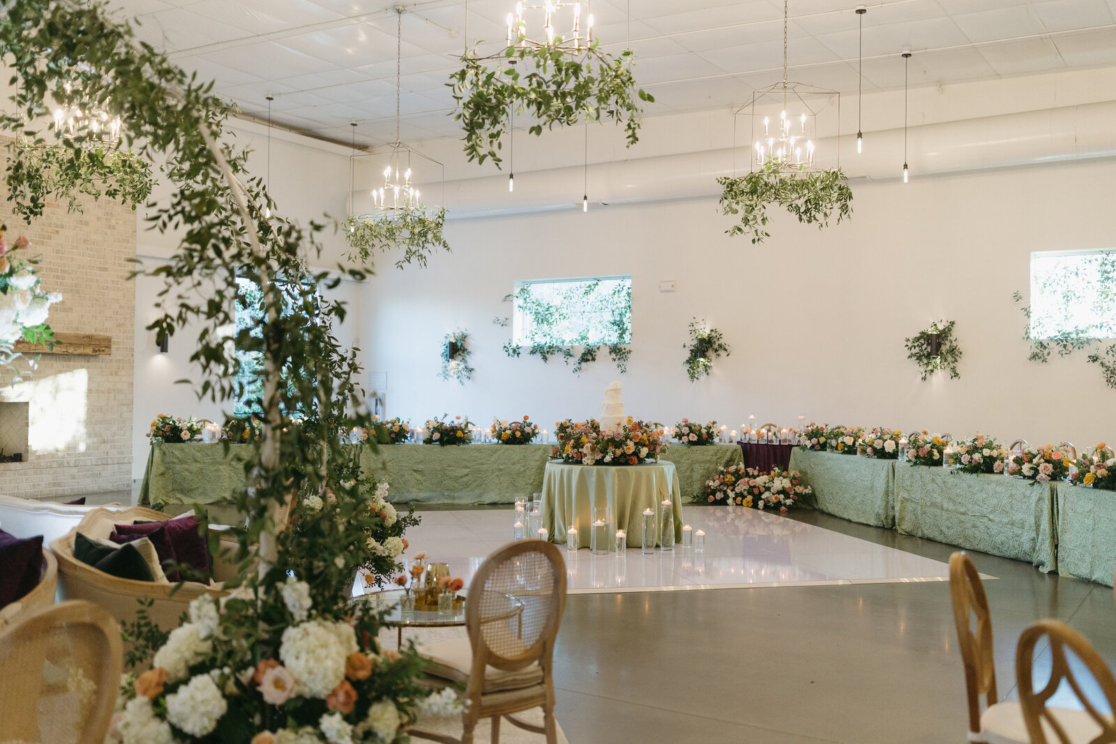 White dance floor and greenery in The Great Room
