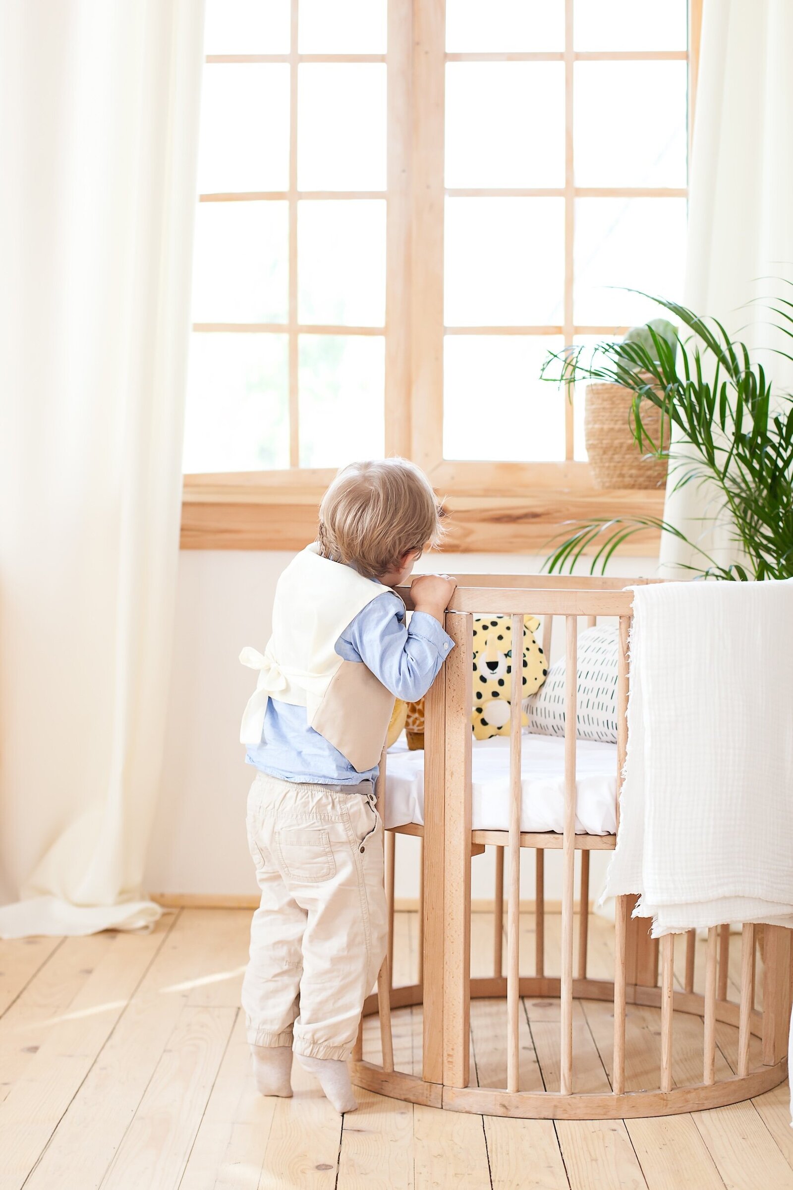 boy-stands-cot-nursery-peeks-lonely-baby-is-kindergarten-near-crib-loneliness-eco-friendly-children-s-room-decor-scandinavian-style-boy-is-home