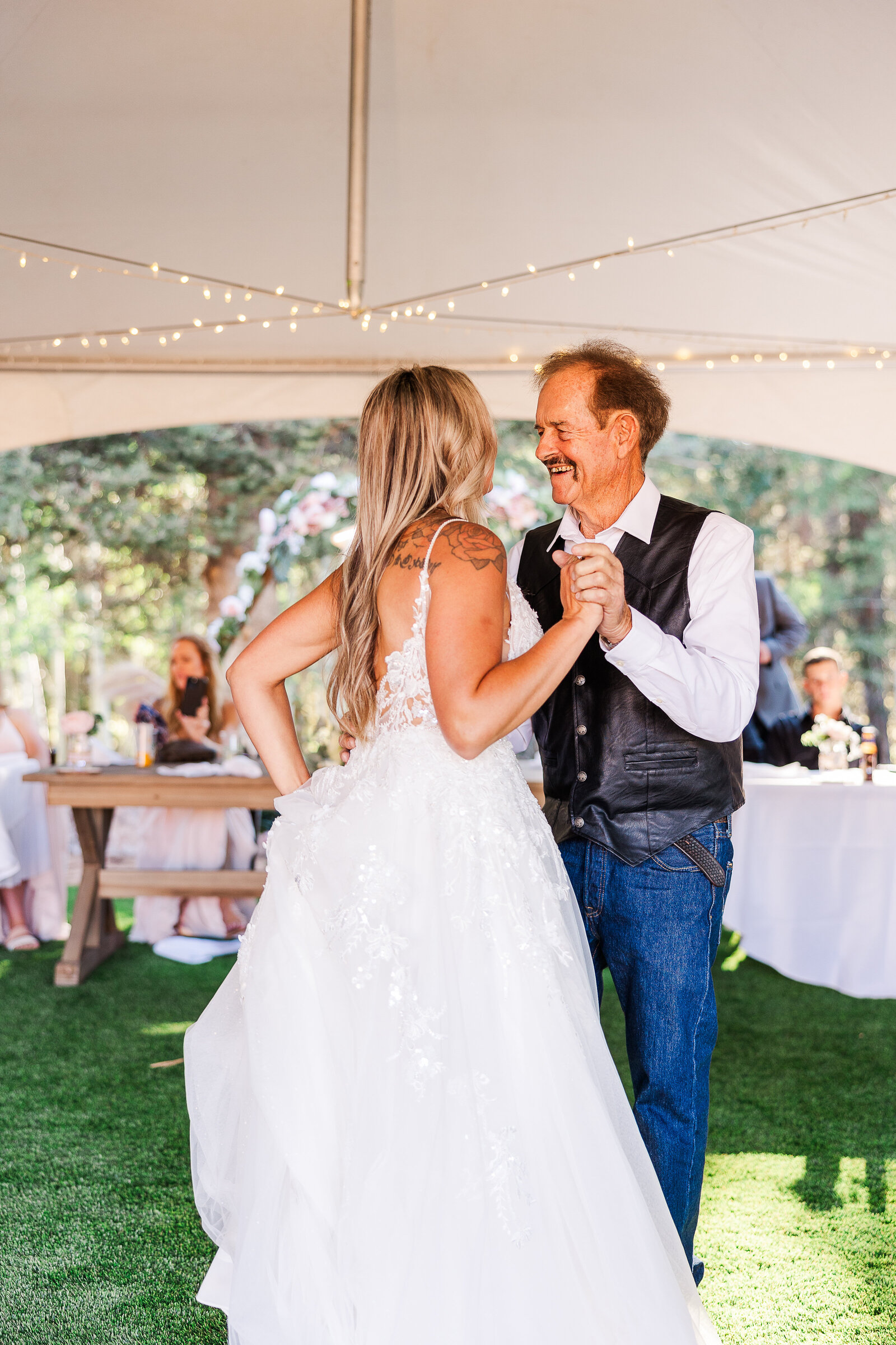 Bride shares a dance with her grandpa at her wedding in this sweet captured moment between them
