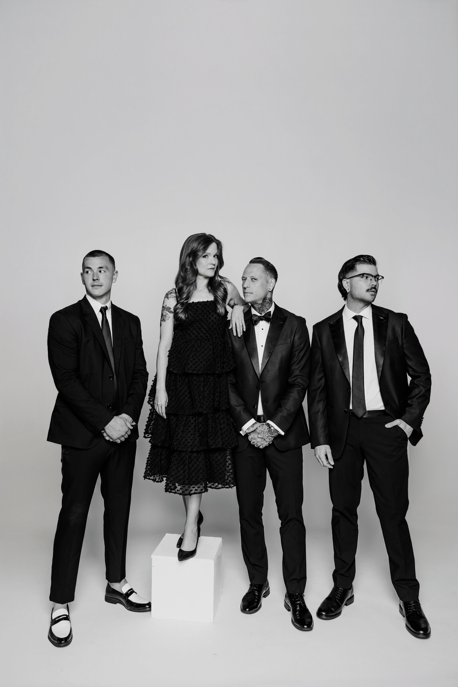 Black-and-white portrait of The Proper Collective’s wedding videography & photography team.
