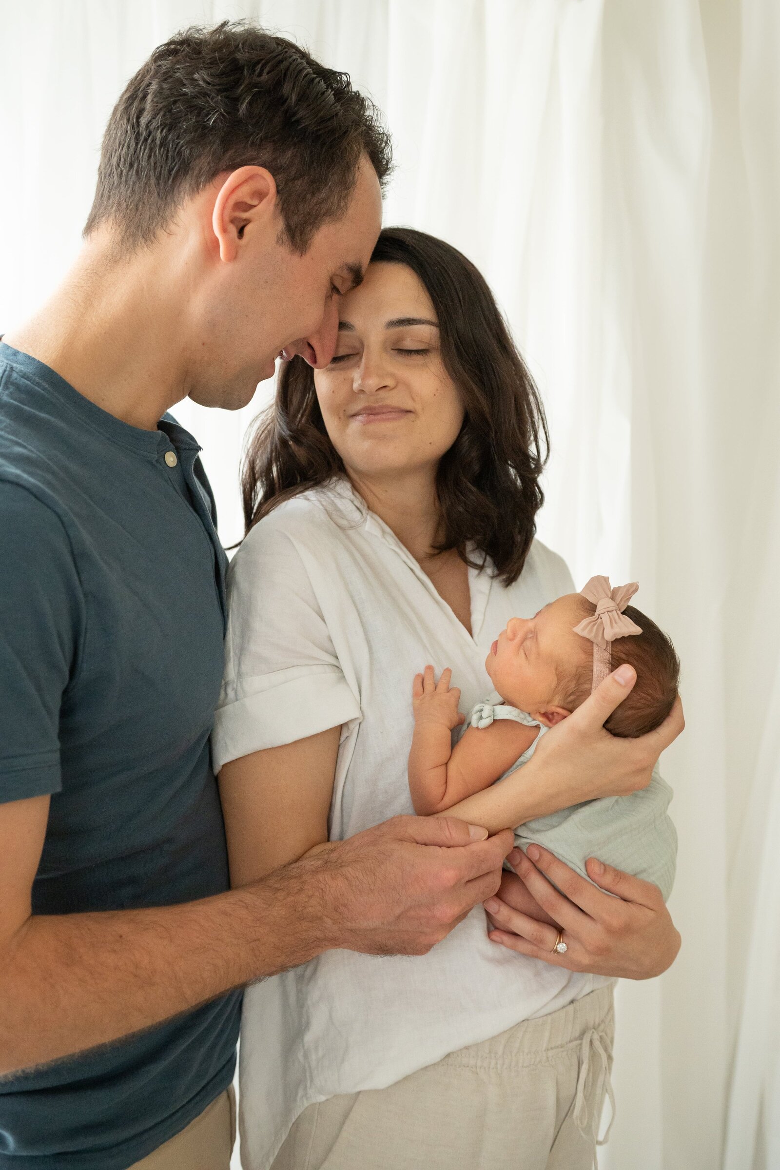 New mom and dad in Baltimore studio during a newborn session