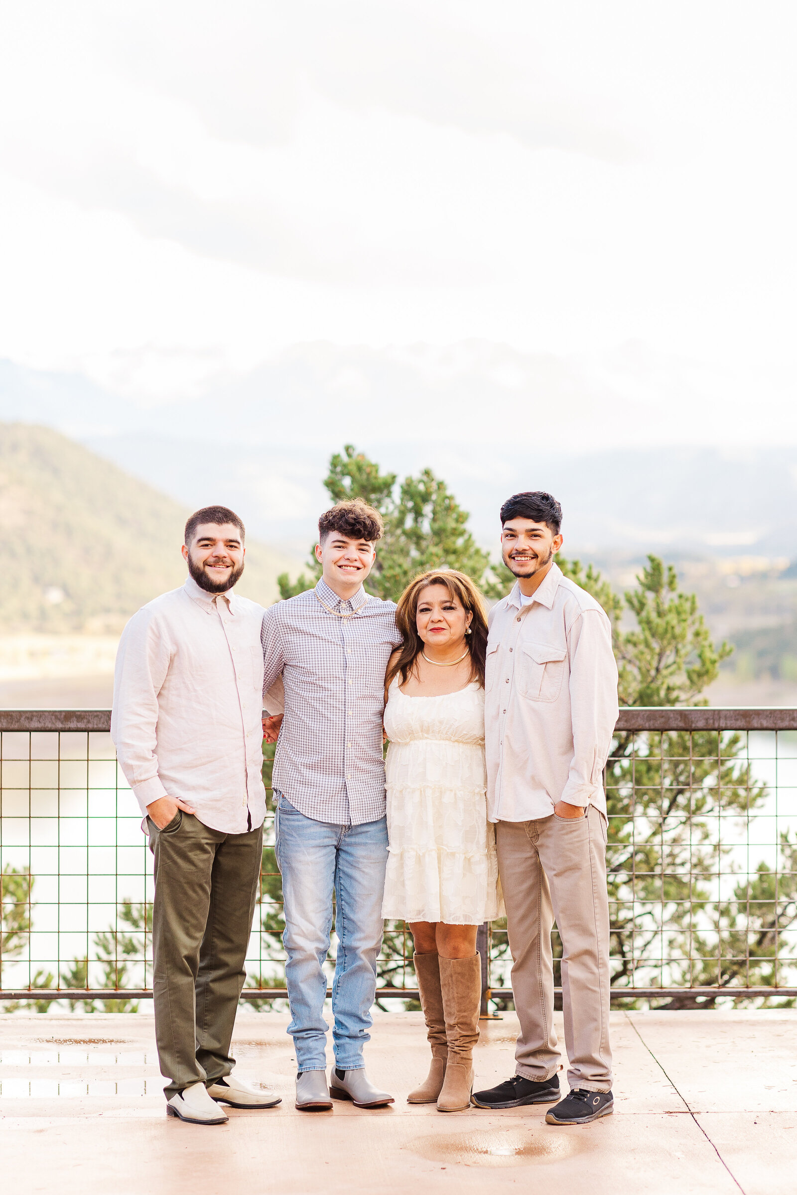 Mom stands with her 3 sons for a picture