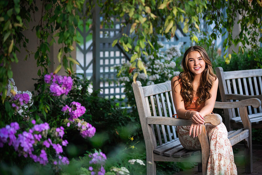 senior-high-school-girl-sitting-bench-purple-flowers-dreamy-bright-colorful