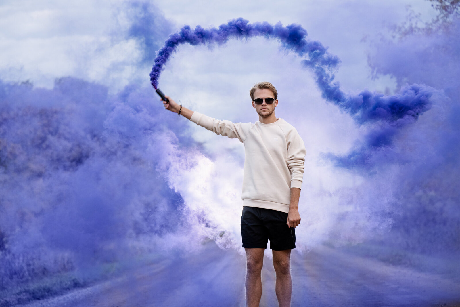 Chanhassen Minnesota high school senior picture of boy with colored smoke