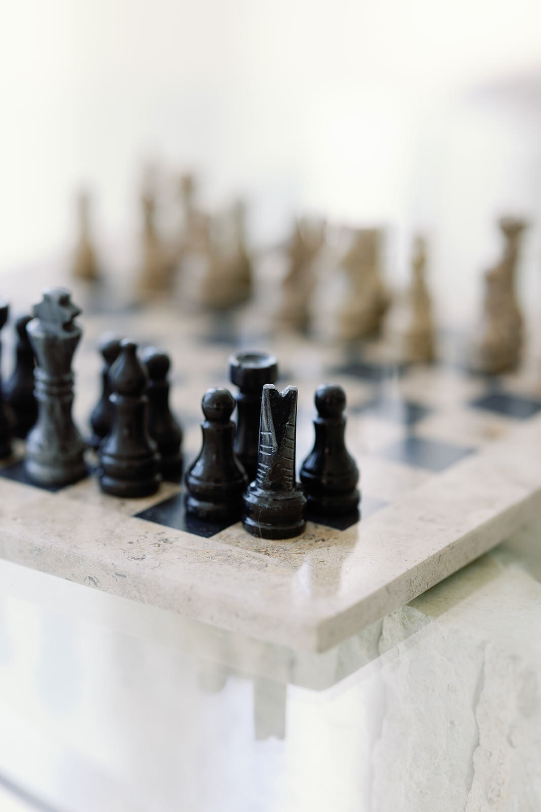 Artistic image of a chessboard on a glass table, adding depth and sophistication to a professional branding portfolio.