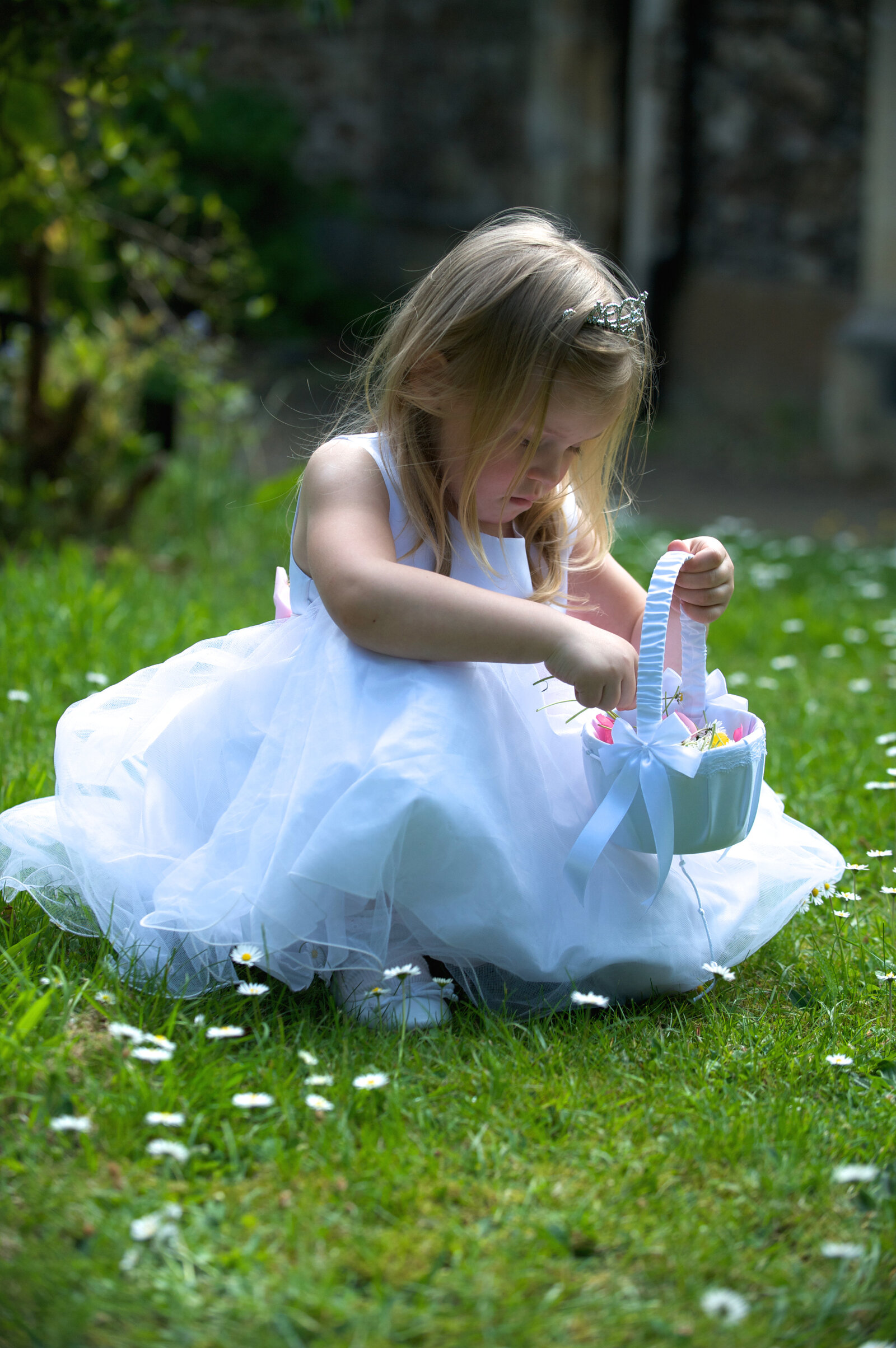 Flower girl picking daisys