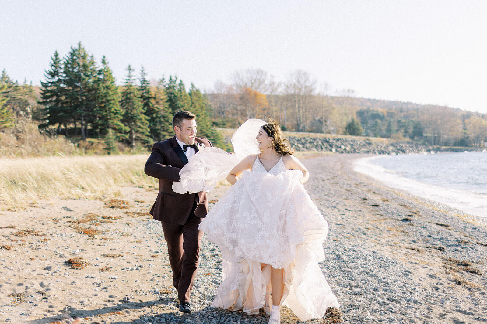 happy-bride-and-groom-running-on-beach