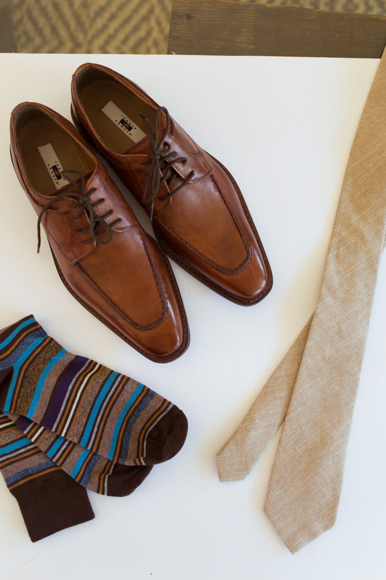 Groom's wedding details- brown shoes, socks and neck tie