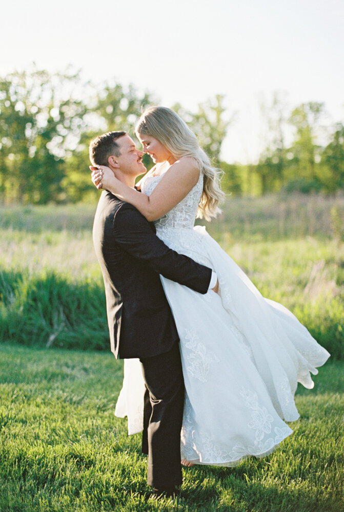 bride and groom hugging