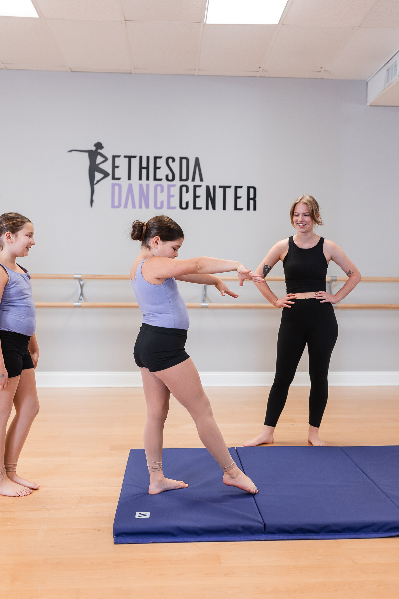 a young dancer prepares to execute a move