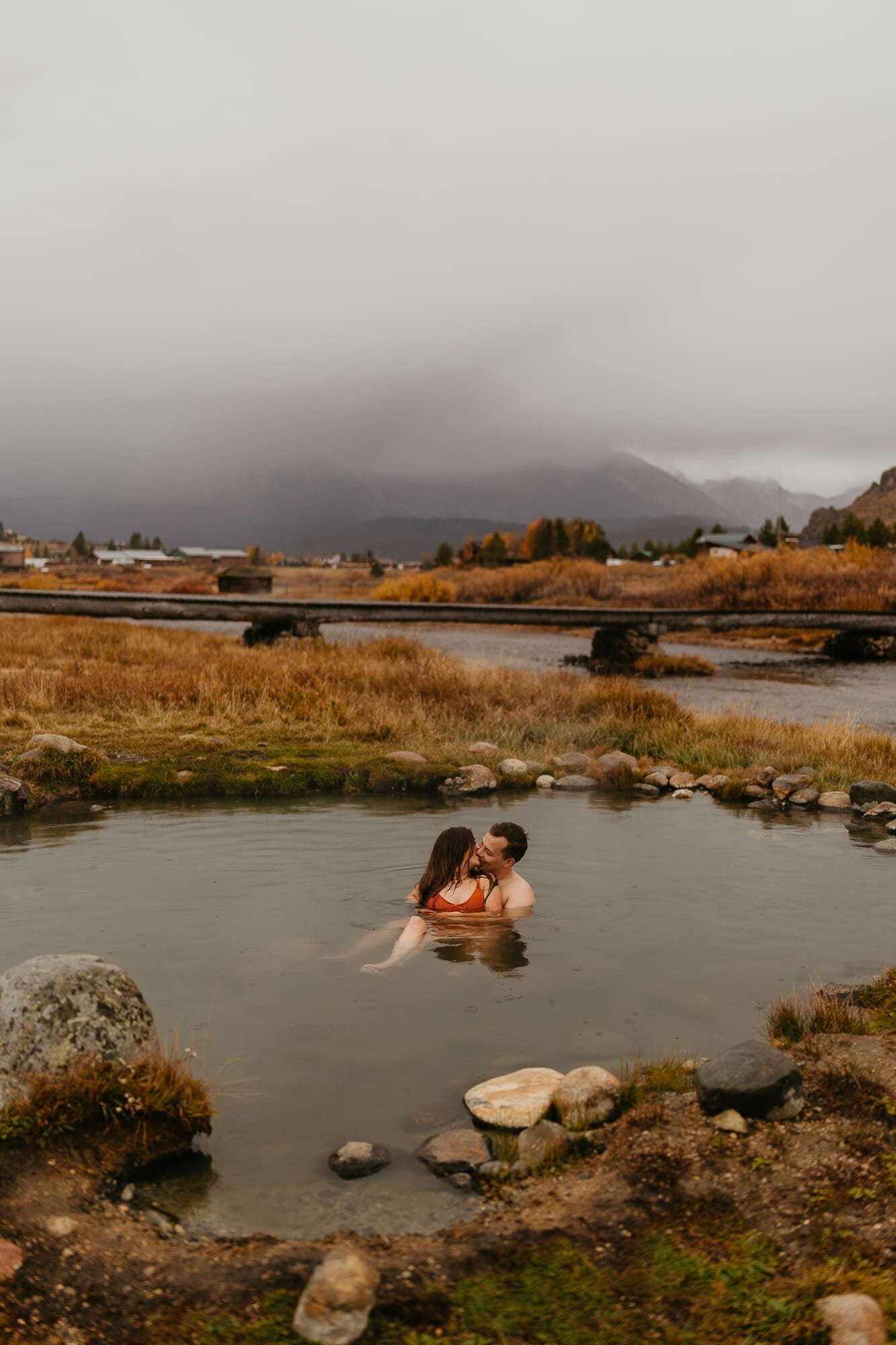 An engagement session at the Mountain Village Resort hot spring in Stanley, Idaho