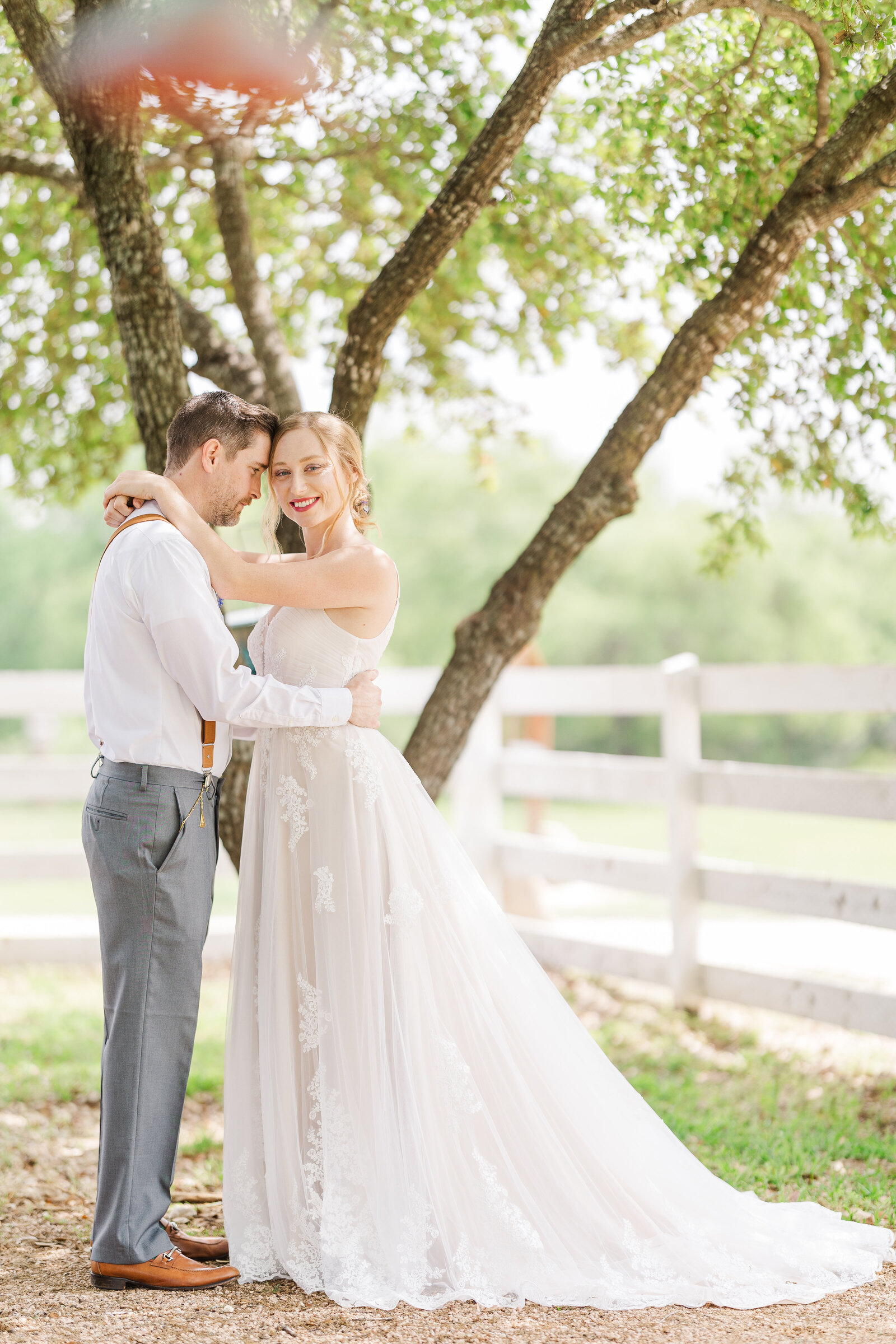 Bride-and-groom-holding-each-other-bride-smiling