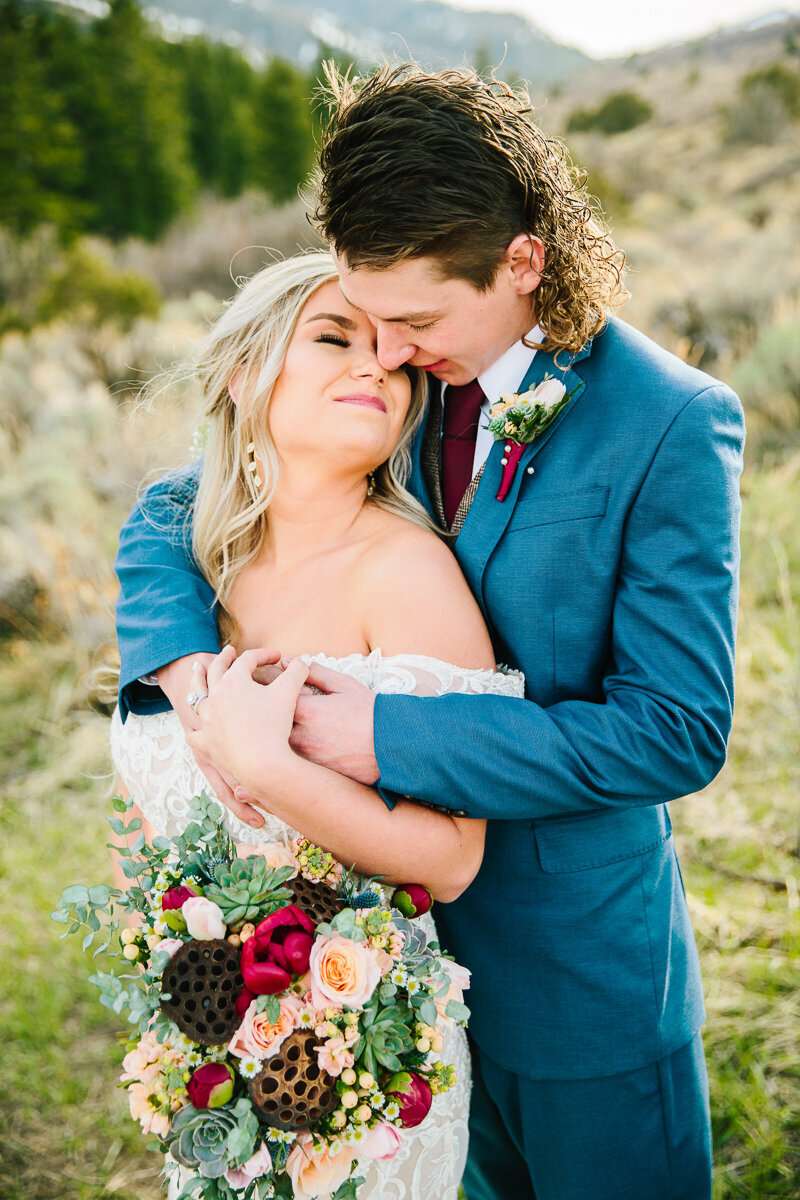 Jackson Hole wedding photographers captures couple hugging after Jackson Hole elopement