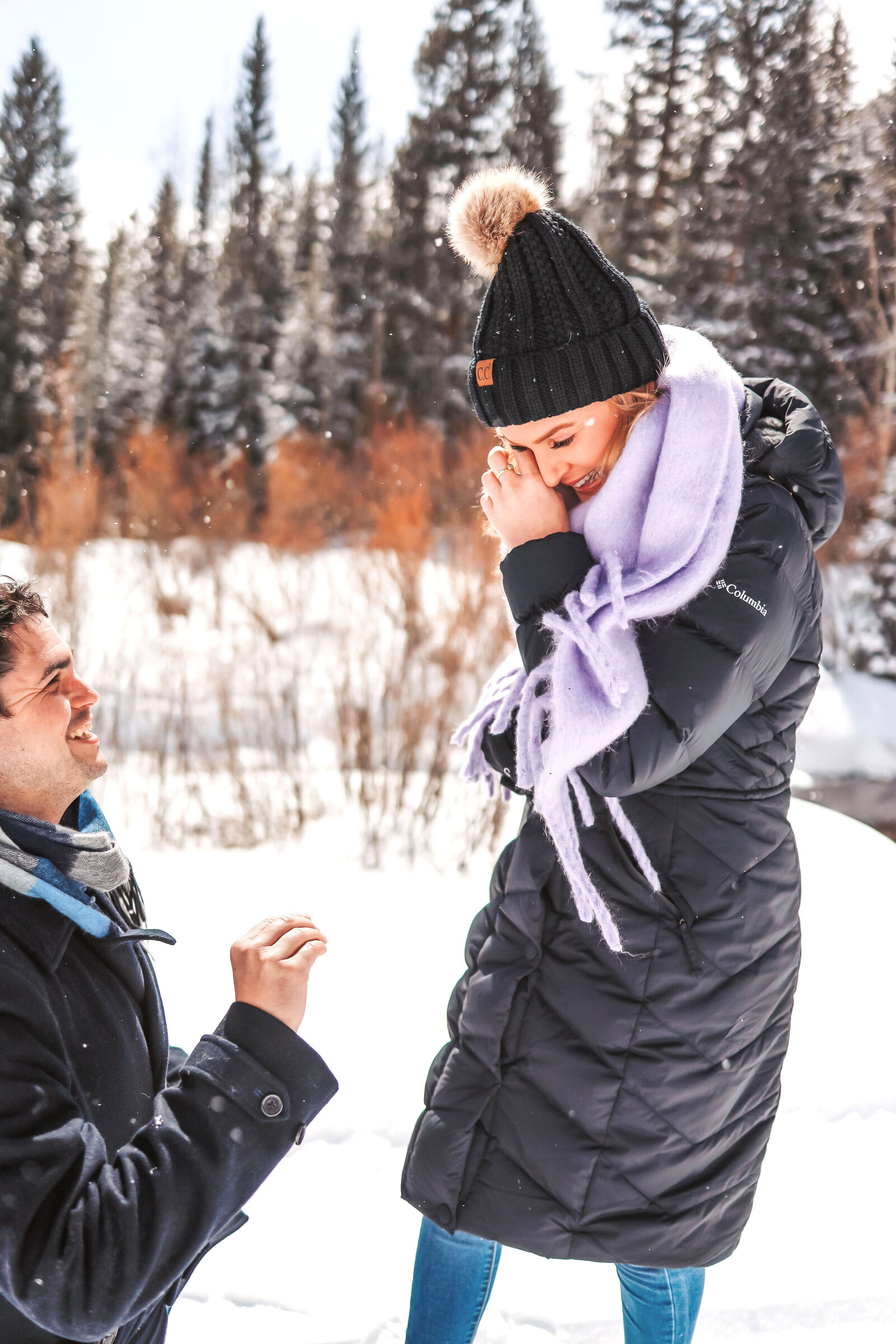 A pinecreek cookhouse surprise proposal, a young man is down on one knee asking his girlfriend to marry him.