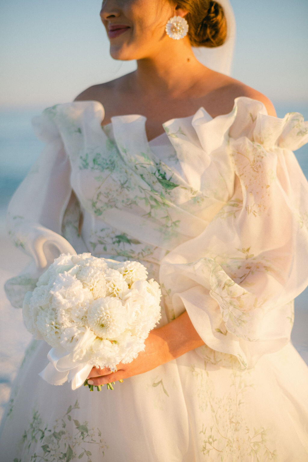 Bride in a floral pattern gown for a beach wedding in Florida