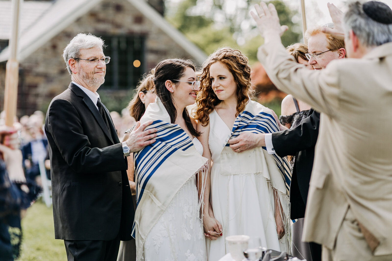 gay brides at jewish wedding ceremony