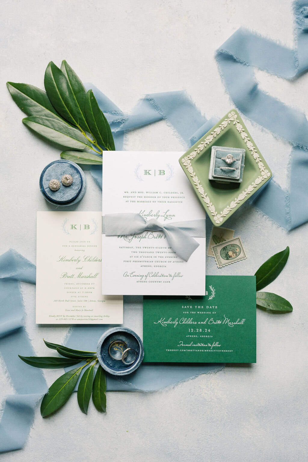 Blue and white invitation suite with green olive leaves
