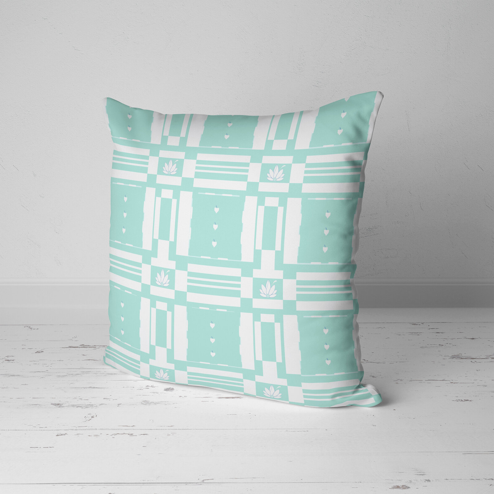 green and white geometric print pillow