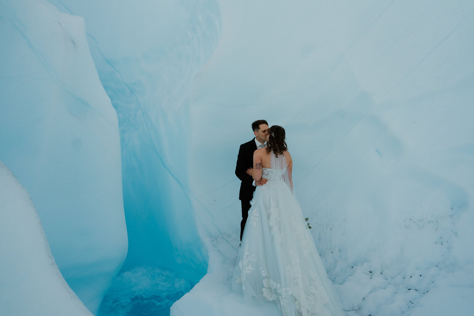 Couple kissing during their Matanuska Glacier Helicopter Elopement in Alaska.