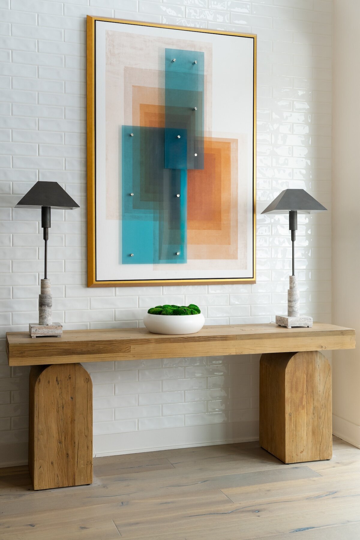 foyer table with Uttermost art for commercial interior design project. Design by Gracious Home Interiors