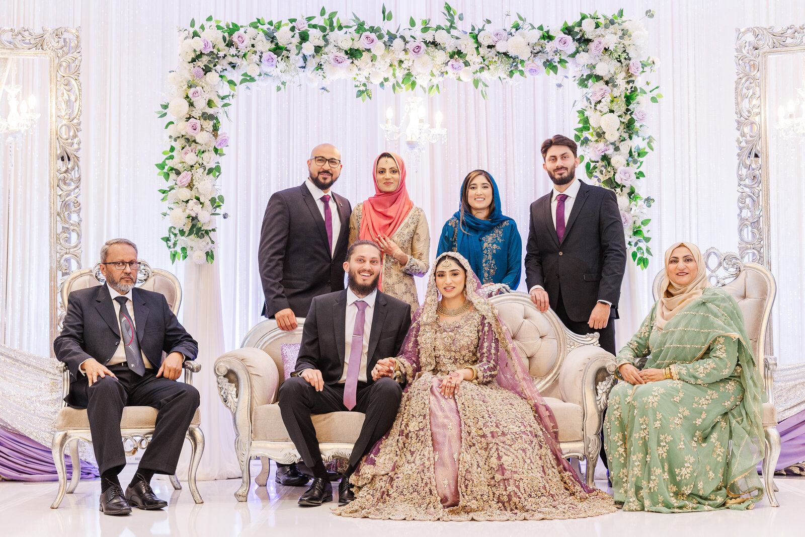 Bride-and-groom-on-stage-with-family