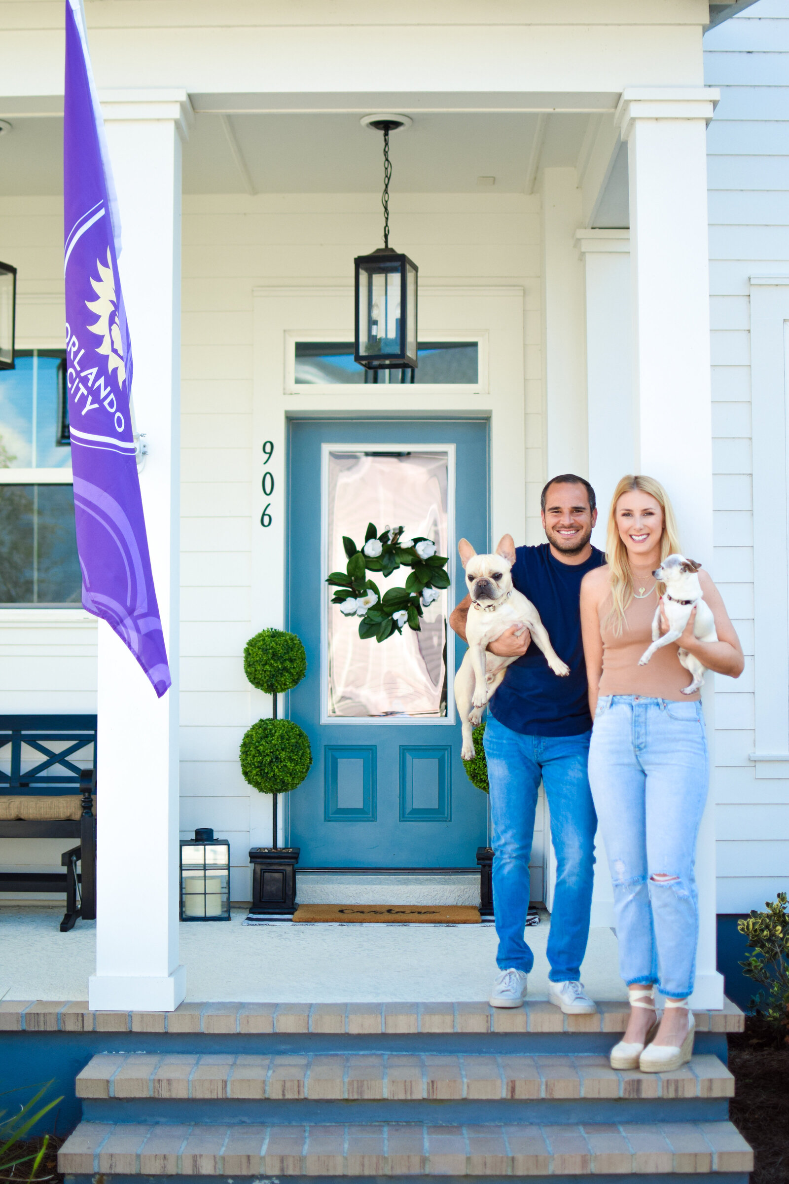 Couple & dogs blue door Front Porch Project Oakland Florida