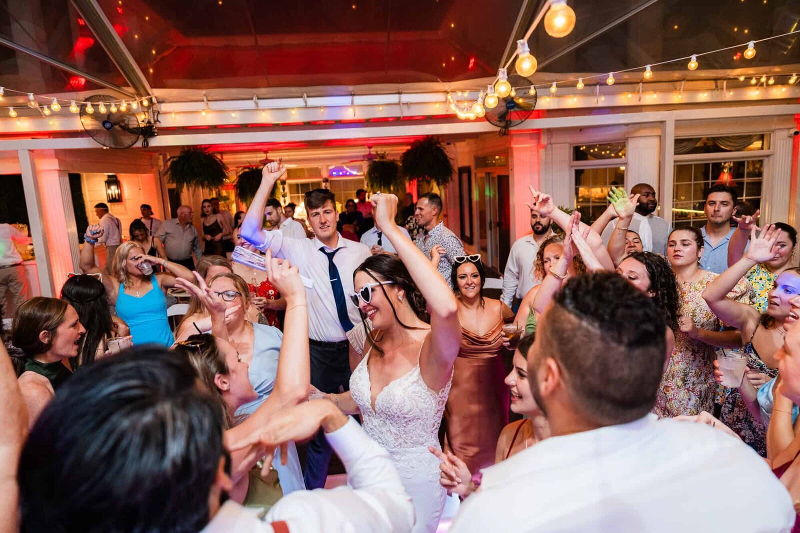 bride dancing with friends at the Wedding reception at The MAckey House wedding venue in Savannah, GA