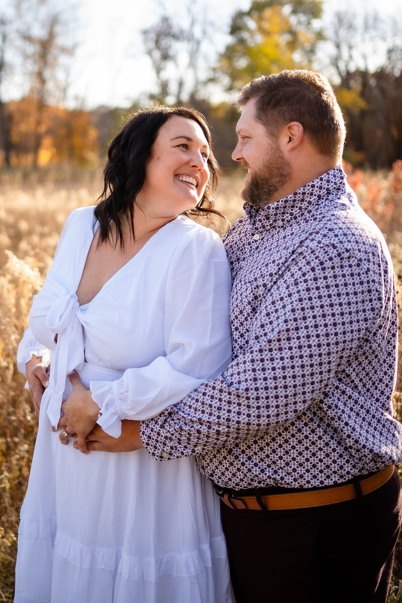 engagement photos in a field at sunset Ledges State Park Des Moines Iowa
