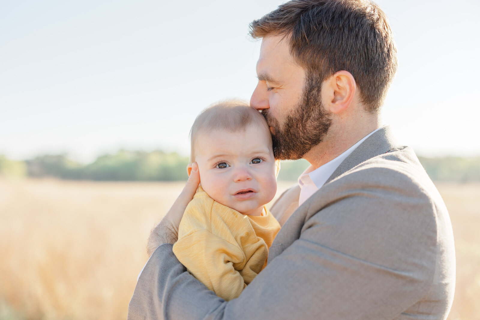 dad kissess baby in Warrenton, Virginia